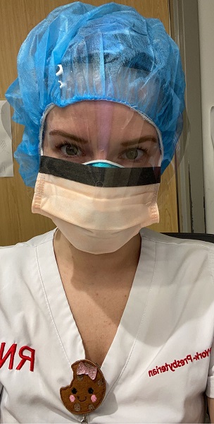 Eileen Sarnes, a female nurse wearing PPE